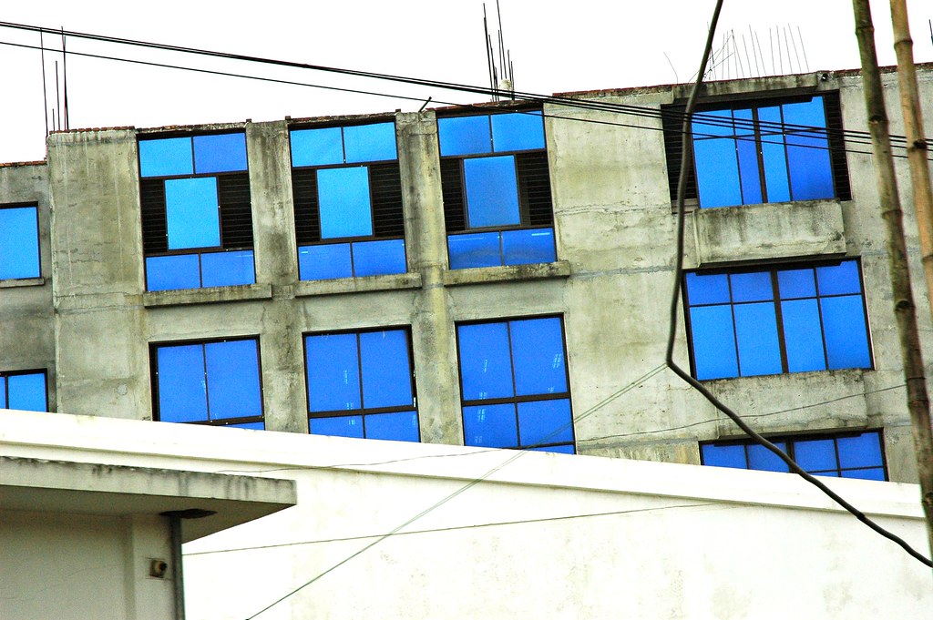 Blue tinted glass office building exterior